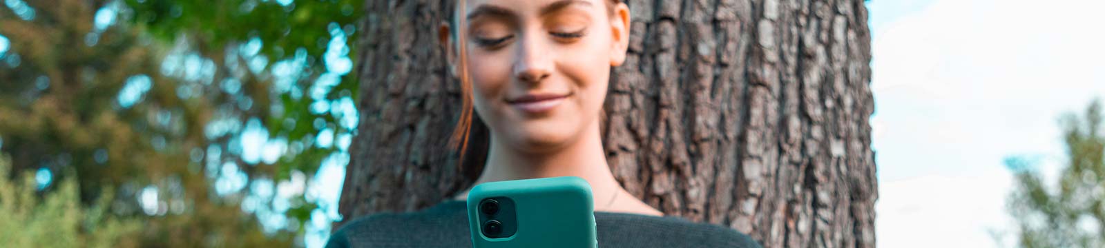 Young lady using a smartphone outside